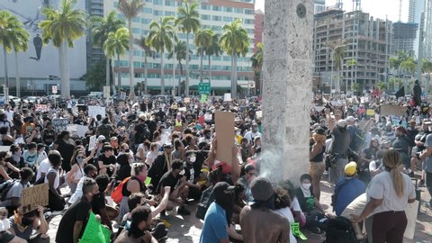 Miami Downtown, FL, USA - MAY 31, 2020: Black Lives Matter. Many american people went to peaceful protests in the US against the George Floyd death: people are protesting. White and black together.