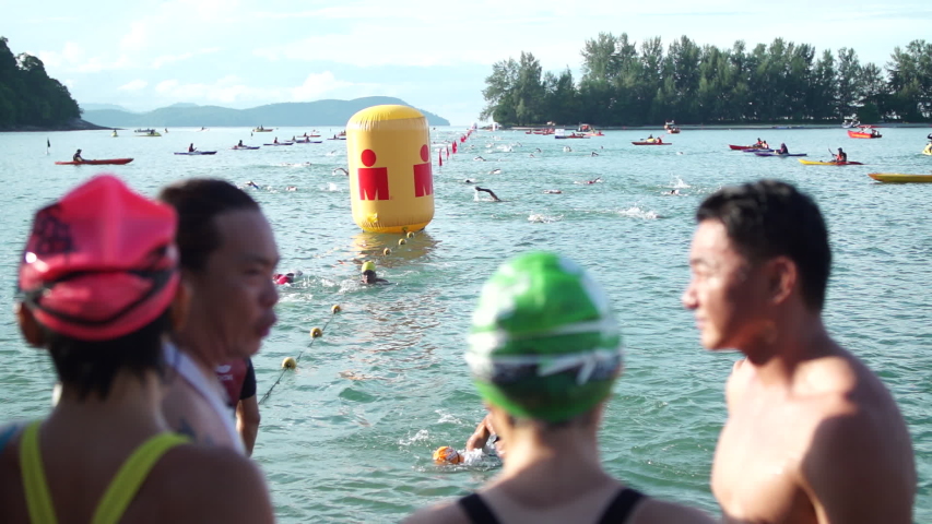 Langkawi, Malaysia - Circa 2019 : B-Roll shots of Triathlon Athletes Swimming during Ironman Swimming Stage