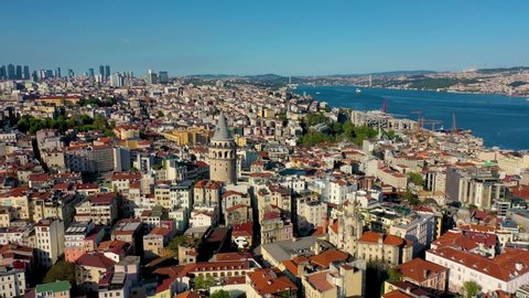 Galata tower in Istanbul, Turkie. Aerial drone shot from above, city centre, downtown. European part of the city. Sunny day, sunset.