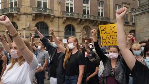 Amsterdam, Netherlands, June 1, 2020. Crowd at Black Lives Matter protest with fists raised. 