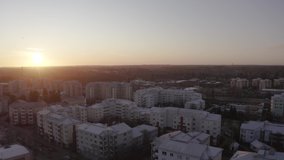 Smooth panoramic drone shot with a wide view above Helsinki at a beautiful sunset.