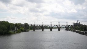 River, flows in the city of Dnieper, Ukraine. A railway arch bridge is visible in the background.