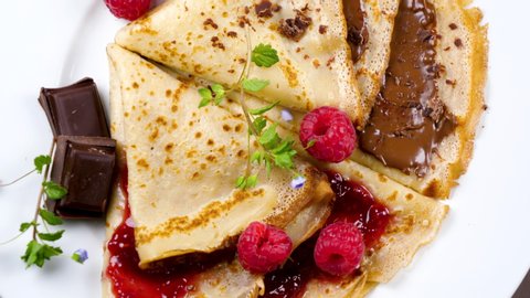 crepe with chocolate sread and raspberry jam