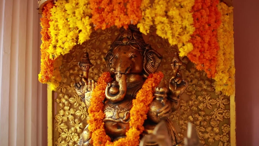 A Ganesh Idol decorated with garlands Royalty-Free Stock Footage #1053612467
