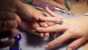 video of manicurist paints womans nails 