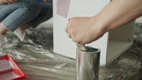 Tracking video of couple painting and choosing the right color. Shot with RED helium camera in 8K