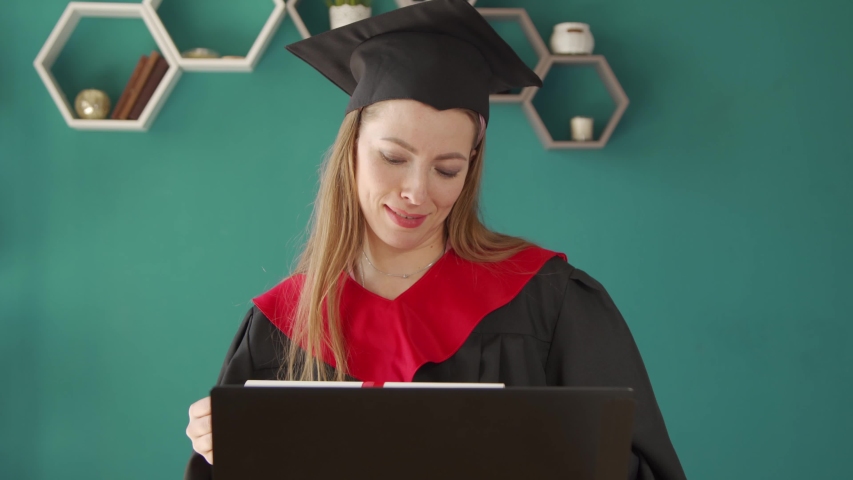 College graduate. Online education, web-based educational videos, online courses and trainings, e-learning concept. Royalty-Free Stock Footage #1053624758