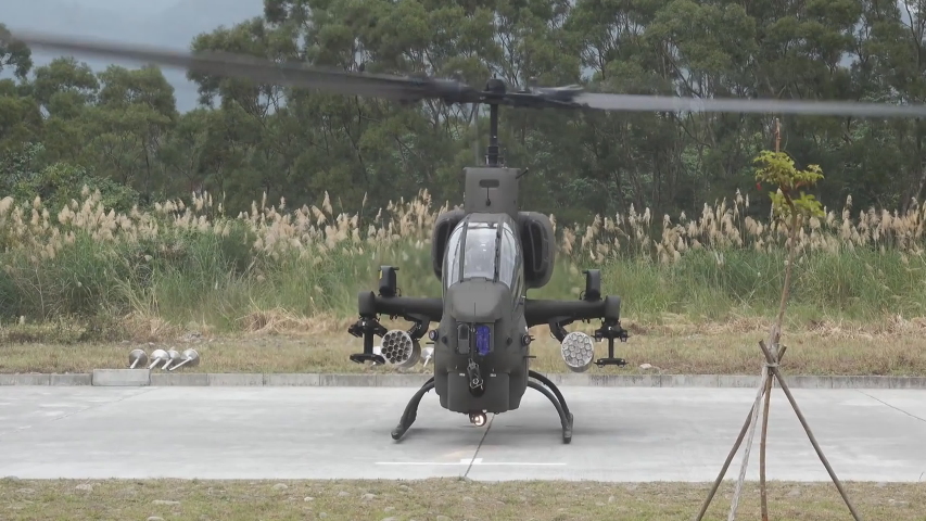 COSFORD, SHROPSHIRE, ENGLAND - Boeing AH-64 Apache attack helicopter taking off for display