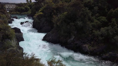 4k hand held panning motion right to left of the Aratiatia rapids which are at the foot of a power station dam where they release a huge water flow at every 2 hours during the day, Taupo, New Zealand	