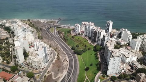 Aerial view of Lima city during coronavirus lockdown in Peru 2020. Flight over Miraflores and Pacific ocean coast. Empty roads and streets, no transport. Self-isolation and quarantine due to pandemic