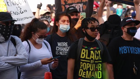 Los Angeles, California / USA - May 29, 2020: People in Downtown Los Angeles protest the brutal Police killing of George Floyd.