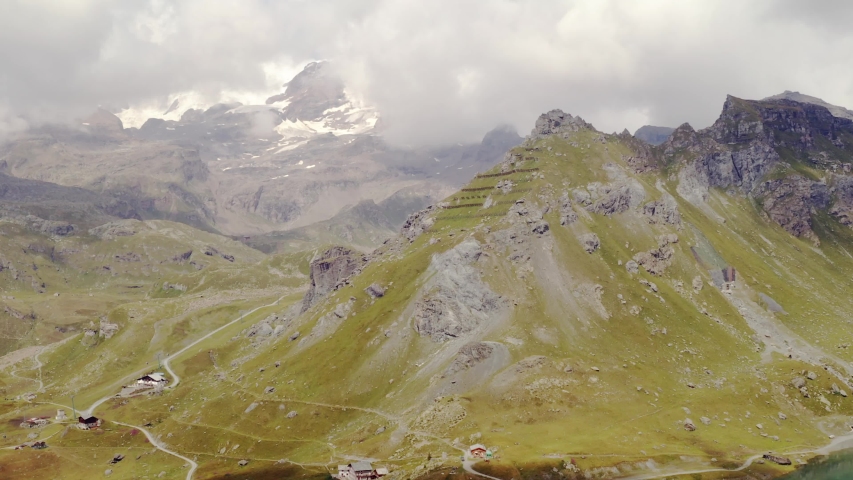 Beautiful landscape of alpine mountain range under cloudy sky