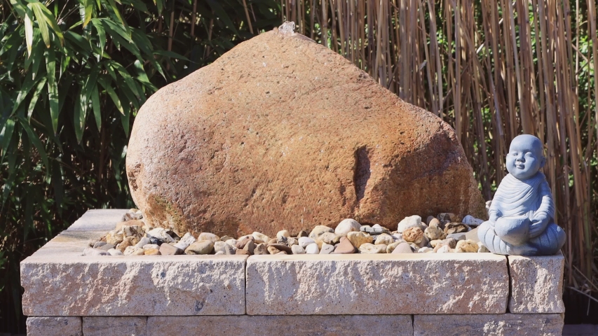 big water stone in the garden 
