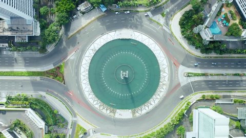 JAKARTA - Indonesia. May 19, 2020: Top down view of empty roads near Hotel Indonesia Roundabout during coronavirus quarantine in Jakarta city. Shot in 4k resolution