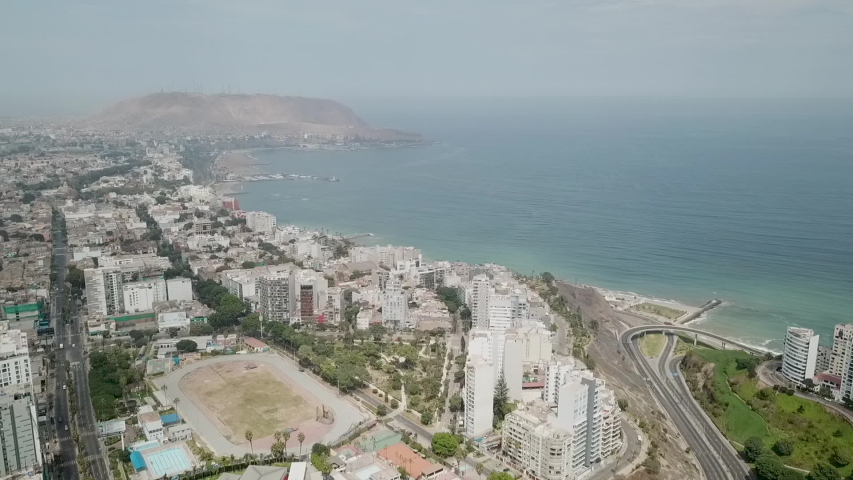 Lima city aerial view during quarantine covid-19 in Peru, Miraflores district, Pacific ocean coast. Stadium, court and roads are empty. Nobody in the streets. No air pollution. Nature is breathing