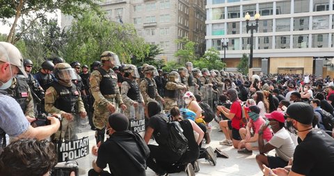 Washington, DC / USA - June 3, 2020: Thousands of people join a Black Lives Matter march near the White House. The National Guard blocks protesters from moving to Lafayette Park. 