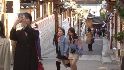 Seoul, South Korea, October 9, 2019: People are walking in Bukchon Hanok(traditional Korean house) Village in Seoul, Korea. This place is good for sightseeing as it has a traditional Korean house.