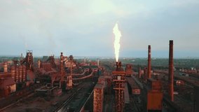 Industrial production plant metallurgical steel aerial video 4K smoke from chad pipes.