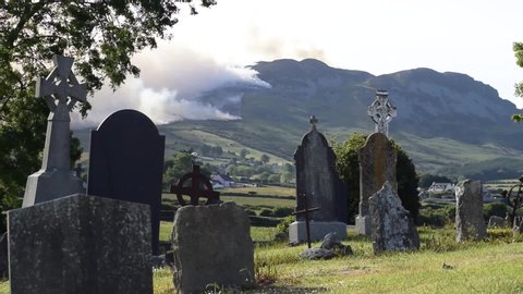 Lordship County Louth Ireland June 3 2020 gorse fire in the Cooley mountains  Jenkinstown Lordship Carlingford area view from ancient Irish graveyard