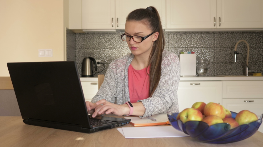 Online work. Young woman works at home office. Ability to work during quarantine.