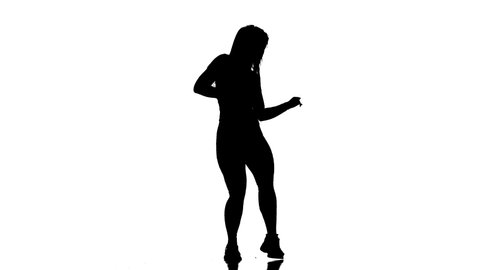 black silhouette on a white background, young beautiful woman dancer in fishnet tights and shorts dancing dancehall twerk, street modern dance, longshot