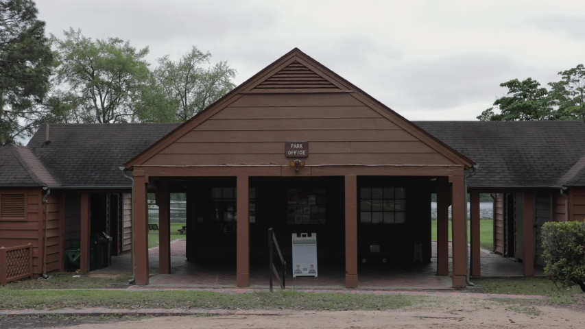 Park office with trees and lake in background