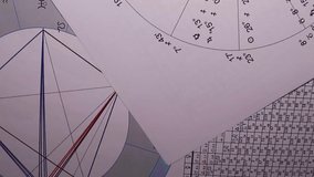 Workplace of a modern astrologer. Astrological charts, tables, diagrams. - Powered by Shutterstock - Get 15% off with code: PIKWIZARD15