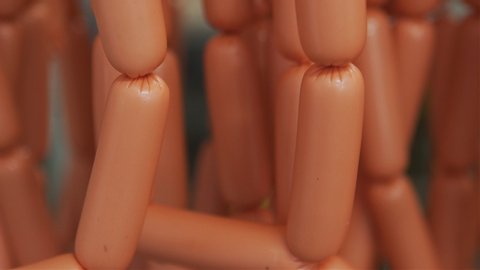 Production of sausages in the meat industry. Close-up view of the fresh sausage .Production of sausages in a food factory. 4k