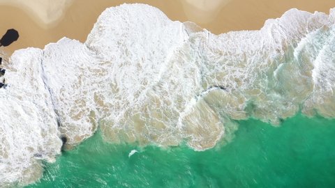 Aerial video of a Blue Baywatch House on a pier surrounded by a turquoise waters of Indian Ocean- South City Beach, Western Australia.