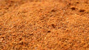 Macro dry  Paprika chili powder background rotates plate with  dry  close up