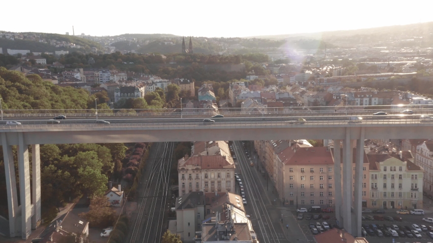 Aerial drone view of highway multi-level junction road with moving cars at sunset. Cars are moving on a multi-level road junction The concept of the urban. Prague, Czechia | Shutterstock HD Video #1053758936