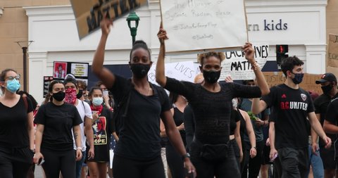Bethesda, Maryland / USA - June 2, 2020: A Black Lives Matters protest is organized in downtown Bethesda by a group of high school students. The protest is peaceful and well organized.