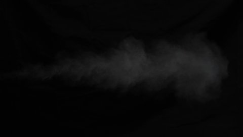 Close up scene on industry white color spray spraying isolated on black background, smoke spout when smoker smoking, toxic fume on exhaust pipe, perfume stream on light in dark, exhale gas in cold air
