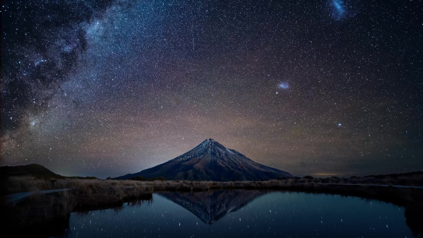 Night sky over Mt. Taranaki reflecting in Pouakai Pool, New Zealand, Timelapse