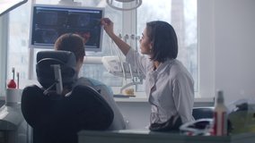 A female doctor discusses with the patient a plan for recovery and rehabilitation of the face after the accident - Powered by Shutterstock - Get 15% off with code: PIKWIZARD15