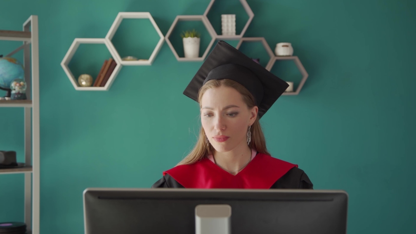 College graduate. Online education, web-based educational videos, online courses and trainings, e-learning concept. Royalty-Free Stock Footage #1053771893