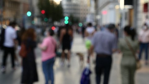 unfocused image of people shopping in phase 1 in Madrid in the State of Alarm in Spain by COVID-19. Filmed on June 4, 2020.