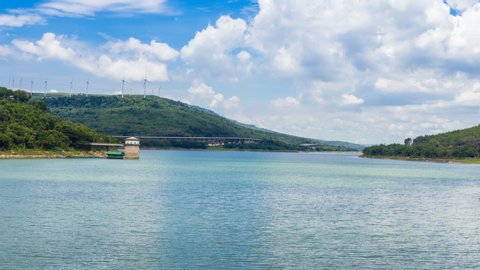4K Time lapse of Landscape with cloud sky, wind turbine and river dam and motorway Bang Pa-in to Korat at Lam Takhong Dam in Nakhon Ratchasima Thailand