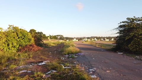 Brasilia, Brazil, May 21, 2020: Trash dumped illegal on a dirt road on the North side of the city of Brasilia, near Burle Marx Park