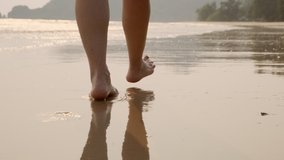 Woman feet walking barefoot on sandy beach of sea. - Powered by Shutterstock - Get 15% off with code: PIKWIZARD15