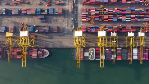 Time lapse container , Container ship in export and import business and logistics. Shipping cargo to harbor by crane. Water transport International. Aerial view and top view