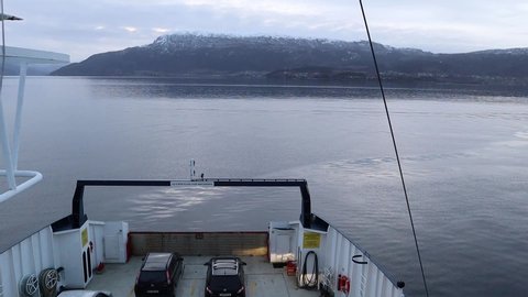 Vestland Norway - mars 26th 2019: A car ferry crossing a Norwegian fjord Hattvik - Vengjaneset