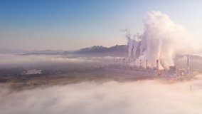 Hyper lapse video 4K, Aerial view Steam or mist over of Power Plant with smoke and toxic air from cooling, Electric of energy, Air pollution environment concept, Lampang Thailand.
