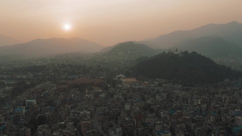 Kathmandu Valley and Monkey Temple in the Sunset - Aerial view over Swaymbhunath Stupa in the northwest by professionell drone