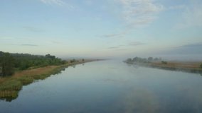 Beautiful view of river in morning, slow motion effect. Drone video recording