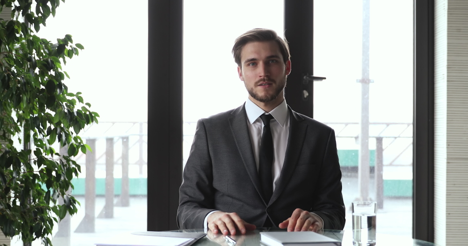 Young businessman wearing suit holding remote online webcam job interview videoconference chat speaking to webcam video calling, recording business video training, giving webinar, consulting client. Royalty-Free Stock Footage #1053841763