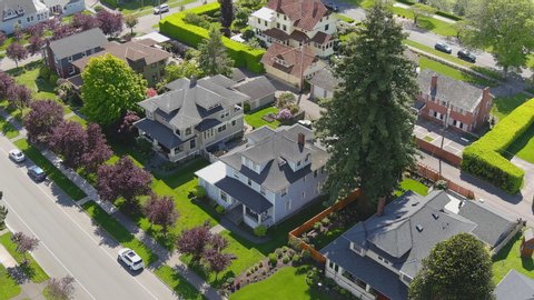 Aerial drone flyover of suburban neighborhood 