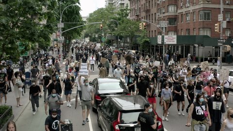 NEW YORK - JUNE 5, 2020: social justice demonstrators marching on 5th Ave after police killing of George Floyd, demonstration in Manhattan New York City NYC.