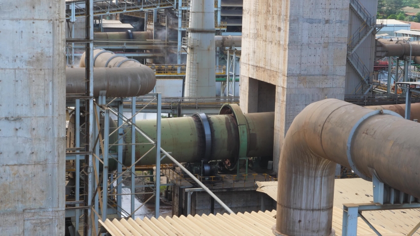 Overhead shot, heavy industry, Equipment layout of the steel plant. Drying kiln equipment in the factory. Scene of ferronickel smelter.steel plant scene filled with white steam, there are various