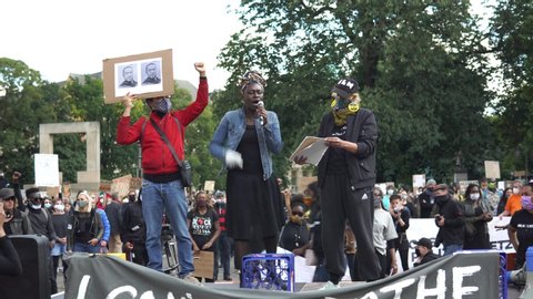 Hannover, Germany, 2020-06-06: Peaceful Black lives matter & anti racism protest outside the Opernplatz Theater after the death of George Floyd. No social distancing 4K